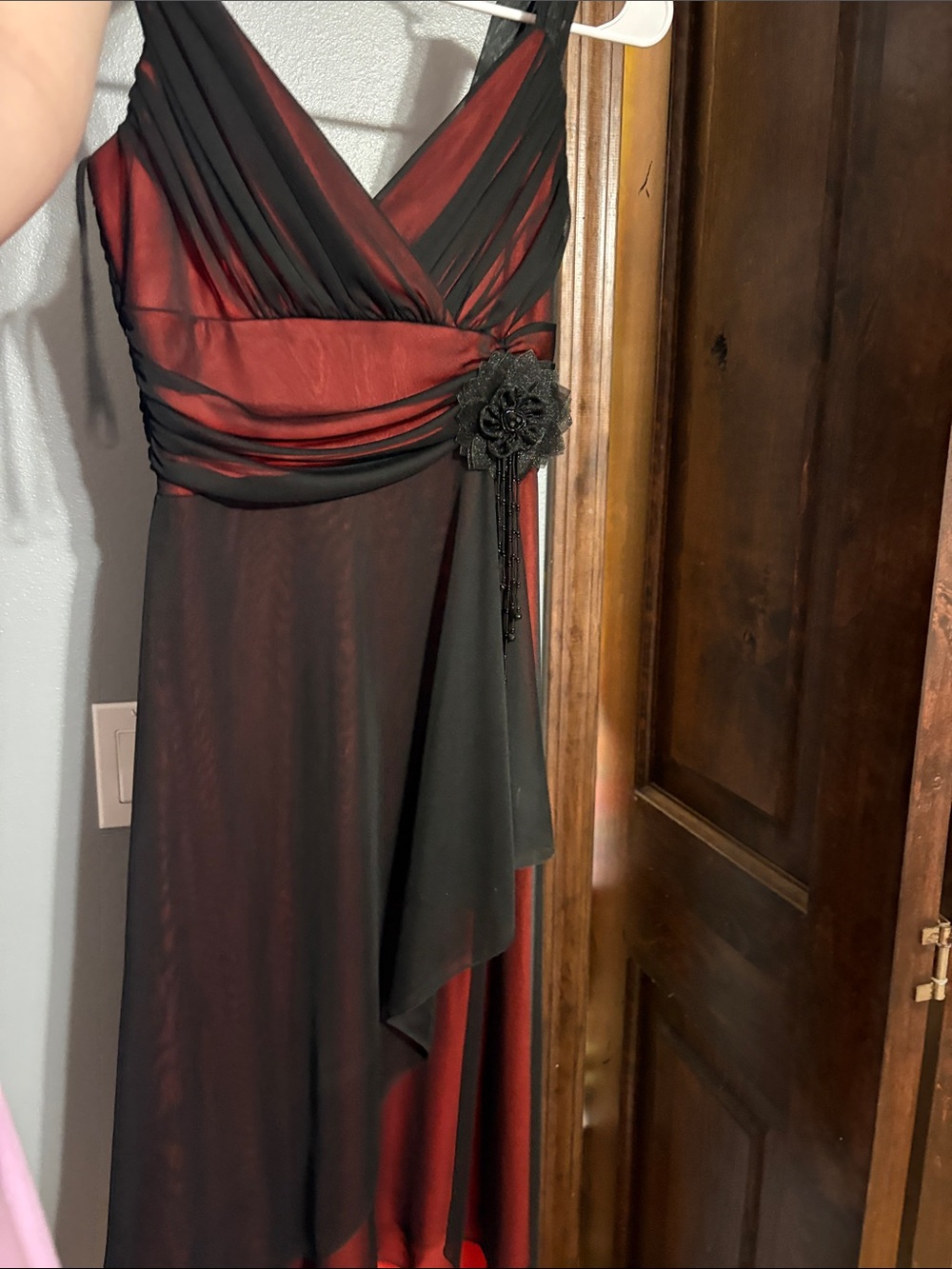 Elegant Black and Red V-Neck Evening Dress with Floral Accent